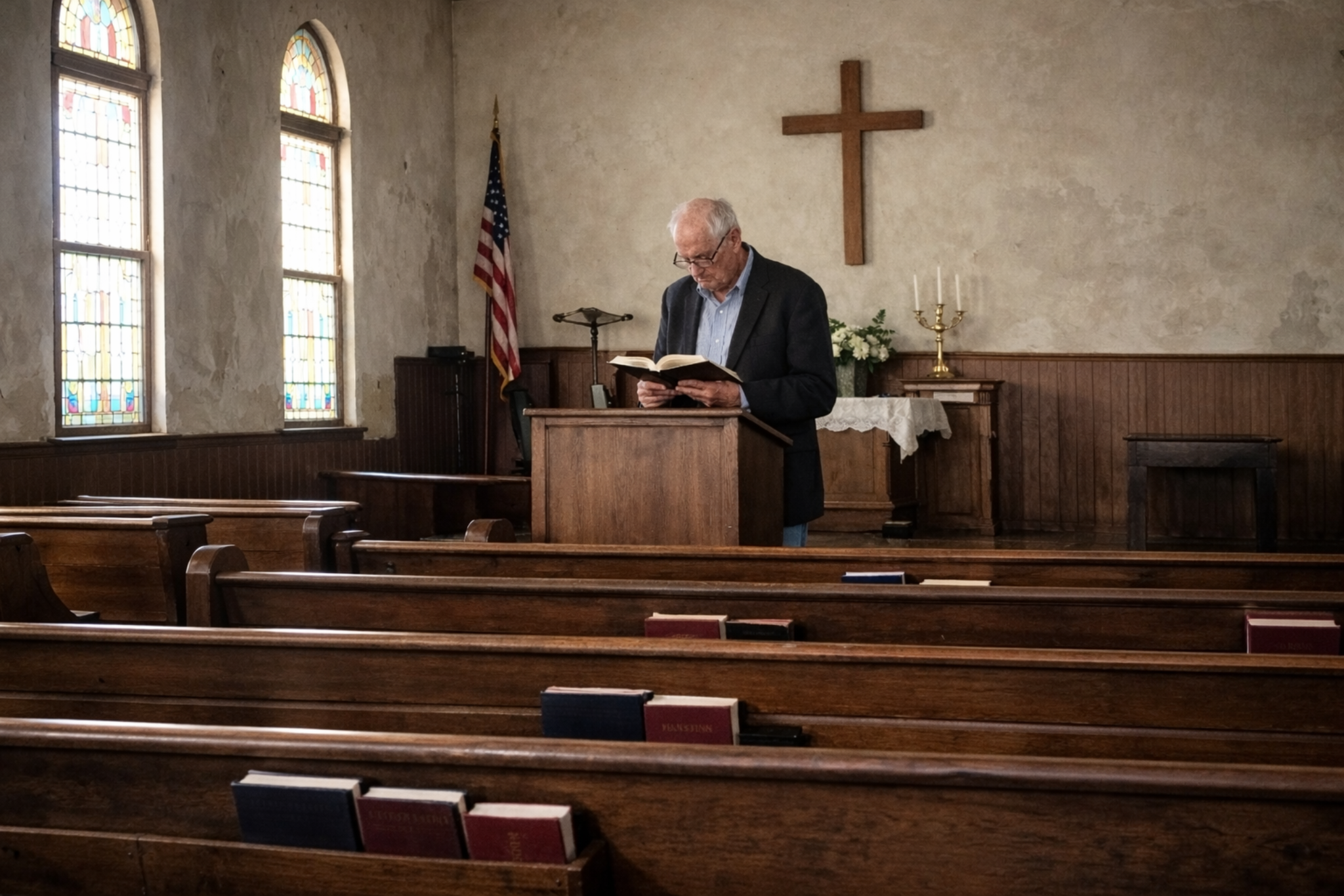 Pastor reading in an empty church